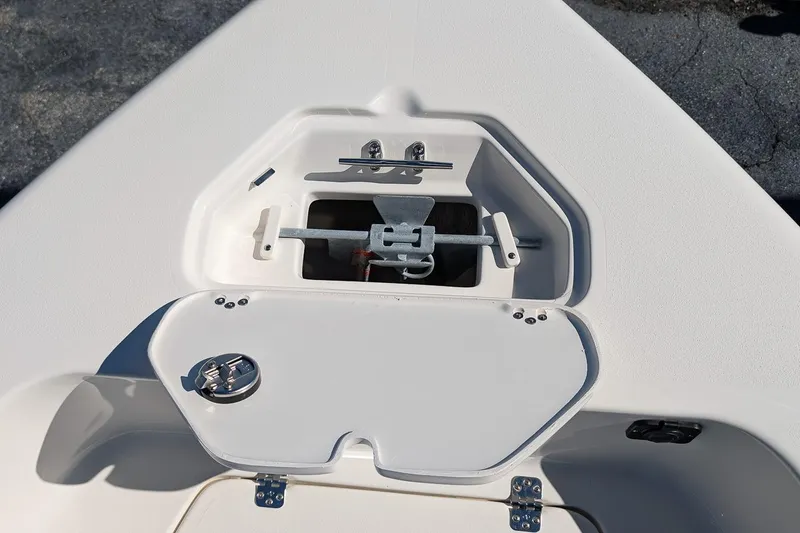 Slide: The Image of Anchor storage compartment on 2026 Key West 179 FS boat, featuring secure latch and clean design. - 15