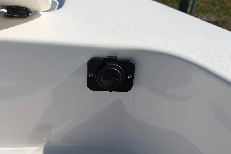 Slide: The Image of 2026 Key West 179 FS boat detail showing a mounted electrical outlet. - 16