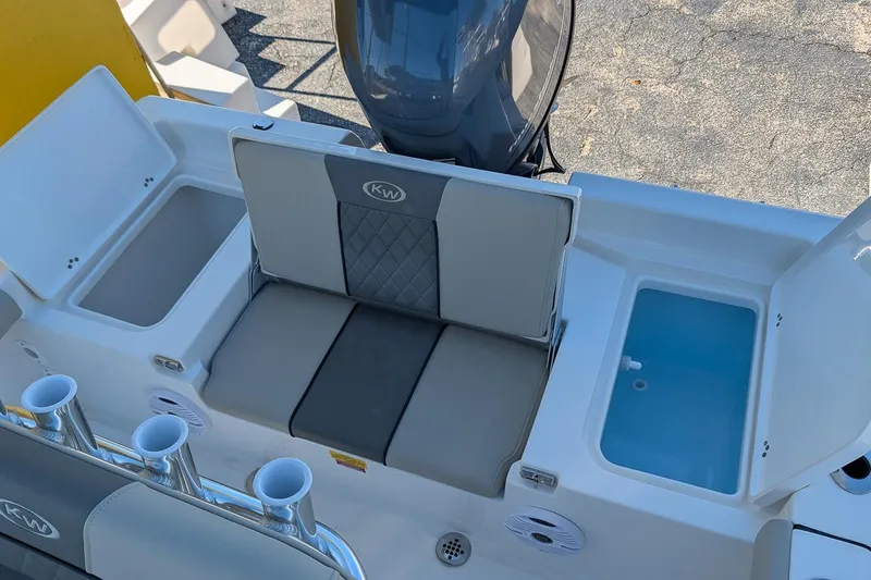 Slide: The Image of 2026 Key West 179 FS boat interior with seating and storage compartments. - 7