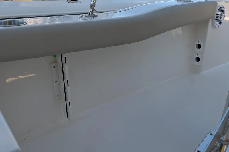 Slide: The Image of 2026 Key West 179 FS boat interior detail with cup holders and speaker. - 8