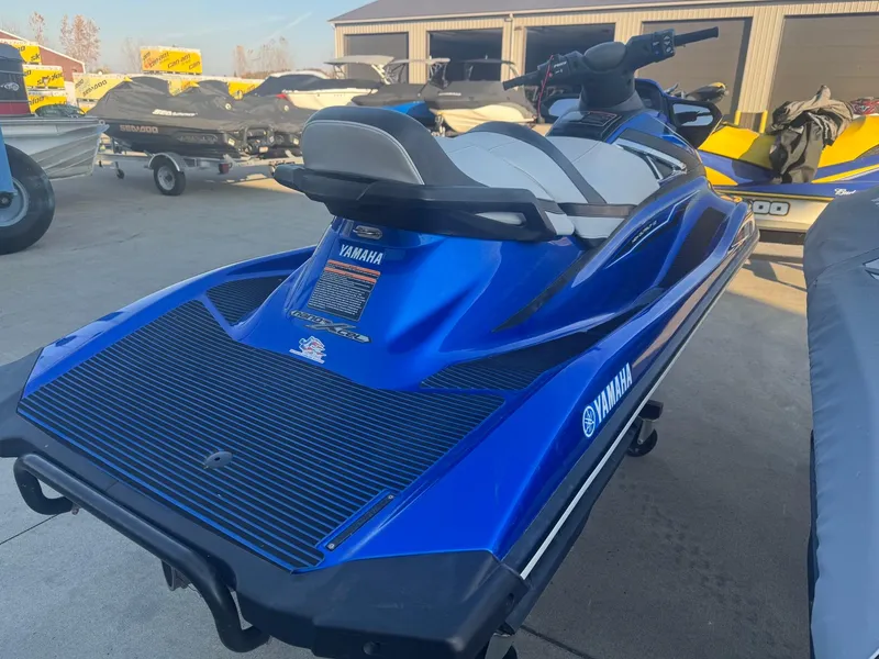 Slide: The Image of 2019 Yamaha WaveRunner VX Cruiser in blue, parked outdoors. - 4