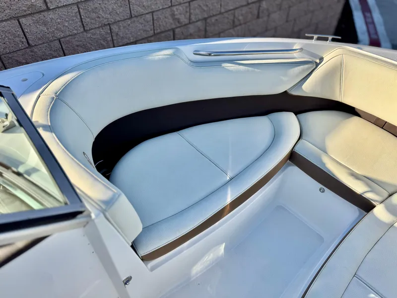 Slide: The Image of 2017 Cobalt 220S boat interior with white leather seating and sleek design. - 10