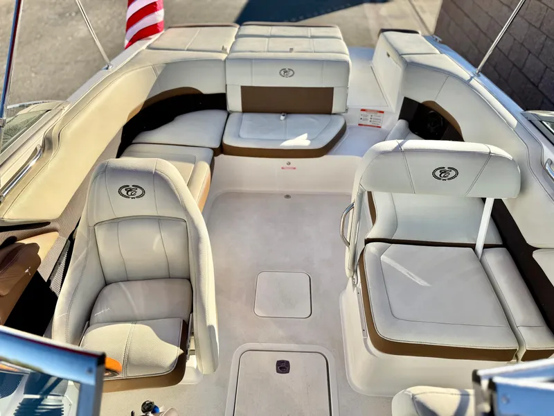 Slide: The Image of 2017 Cobalt 220S boat interior with plush seating and American flag. - 11