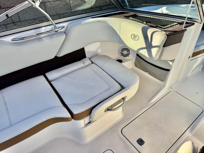 Slide: The Image of 2017 Cobalt 220S boat interior with white leather seating and sleek design. - 13