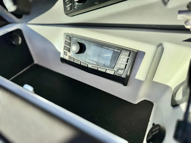 Slide: The Image of Dashboard of a 2017 Cobalt 220S boat featuring a control panel. - 17