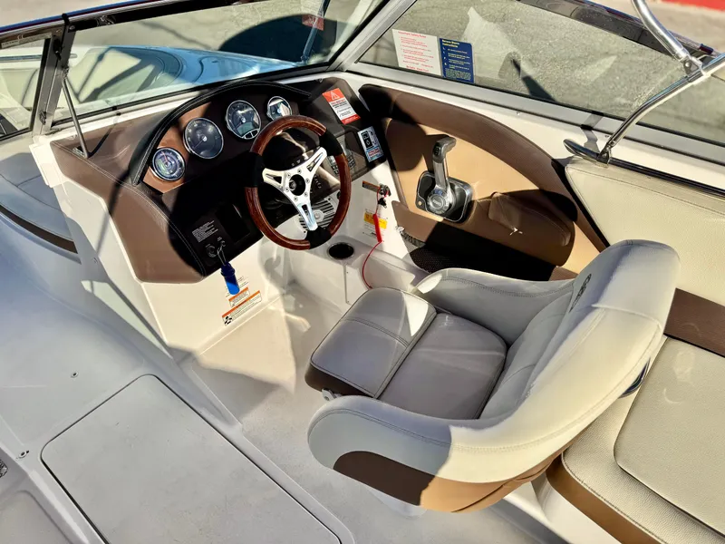 Slide: The Image of 2017 Cobalt 220S boat interior with steering wheel and dashboard controls. - 23