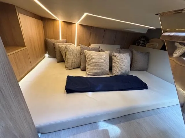Slide: The Image of Luxurious cabin interior of 2023 NX Boats 360 with cozy cushions and modern lighting. - 34