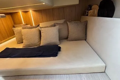 Slide: The Image of Luxurious interior cabin of 2023 NX Boats 360 with cozy cushions and ambient lighting. - 44