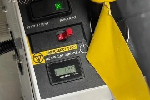 Slide: The Image of Control panel of 2023 NX Boats 360 with emergency stop and circuit breaker. - 47