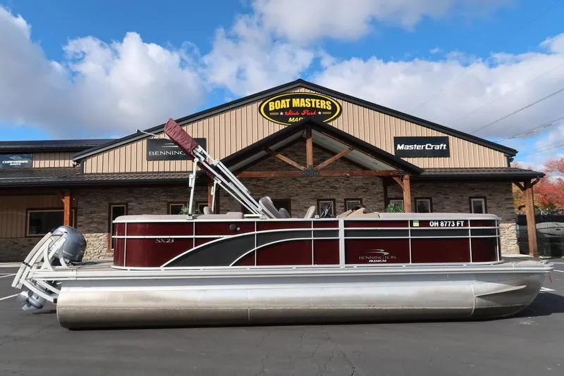 The Image of 2018 Bennington 23SPDXP pontoon boat in front of Boat Masters Marine building. - 1