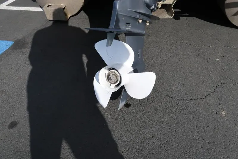 Slide: The Image of Close-up of a 2018 Bennington 23SPDXP boat propeller on asphalt. - 10