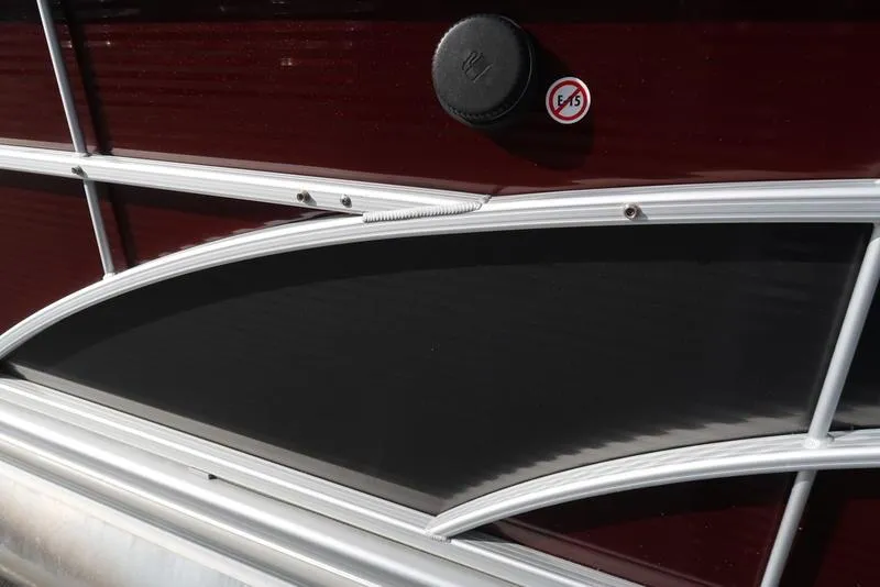 Slide: The Image of Close-up of 2018 Bennington 23SPDXP boat exterior with sleek maroon and black design. - 16