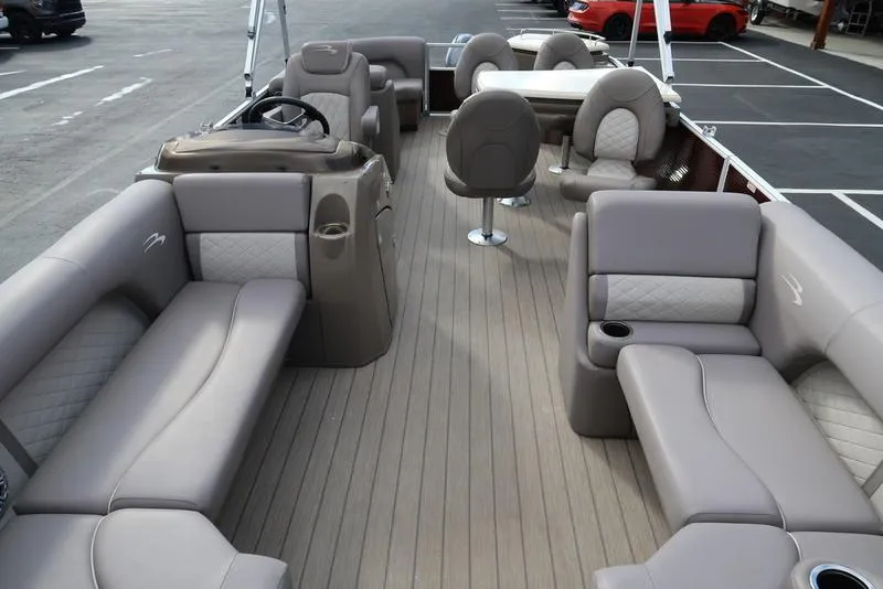 Slide: The Image of 2018 Bennington 23SPDXP pontoon boat with spacious seating and modern interior design. - 20