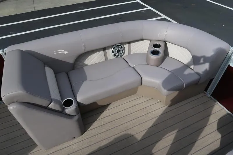 Slide: The Image of 2018 Bennington 23SPDXP boat seating with cup holders and speaker on deck. - 22