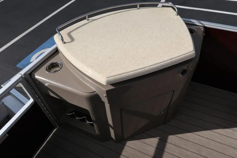 Slide: The Image of Bennington 23SPDXP 2018 boat bar area with countertop and cup holders. - 28