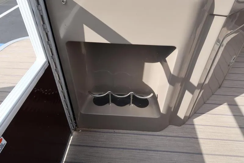 Slide: The Image of Cup holder on 2018 Bennington 23SPDXP boat, beige interior detail. - 30