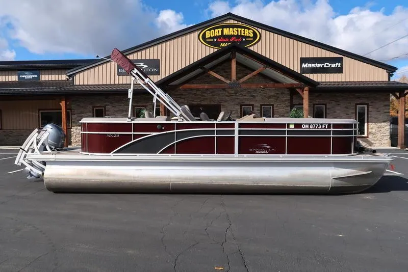Slide: The Image of 2018 Bennington 23SPDXP pontoon boat parked at Boat Masters dealership. - 4