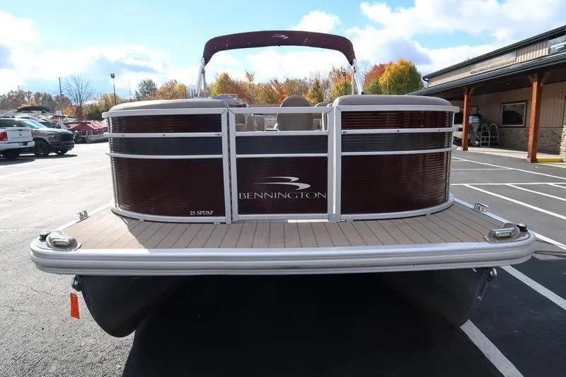 Slide: The Image of 2018 Bennington 23SPDXP pontoon boat in parking lot, autumn background. - 5