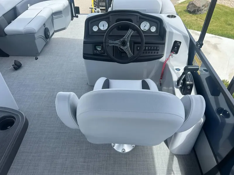 Slide: The Image of 2024 Bentley Pontoons Legacy Cruise XL interior with steering wheel and seating. - 5