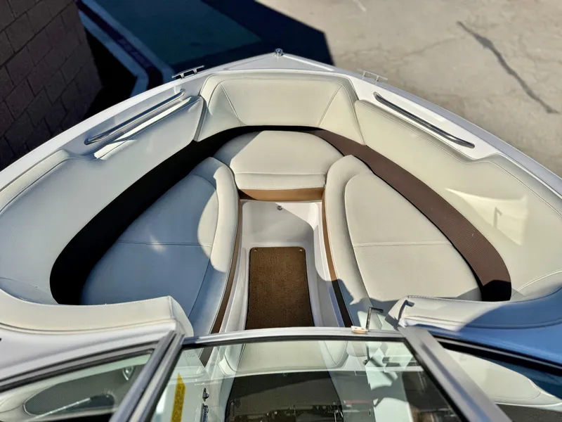 Slide: The Image of Cobalt 220S 2017 boat interior with white and brown seating. - 10