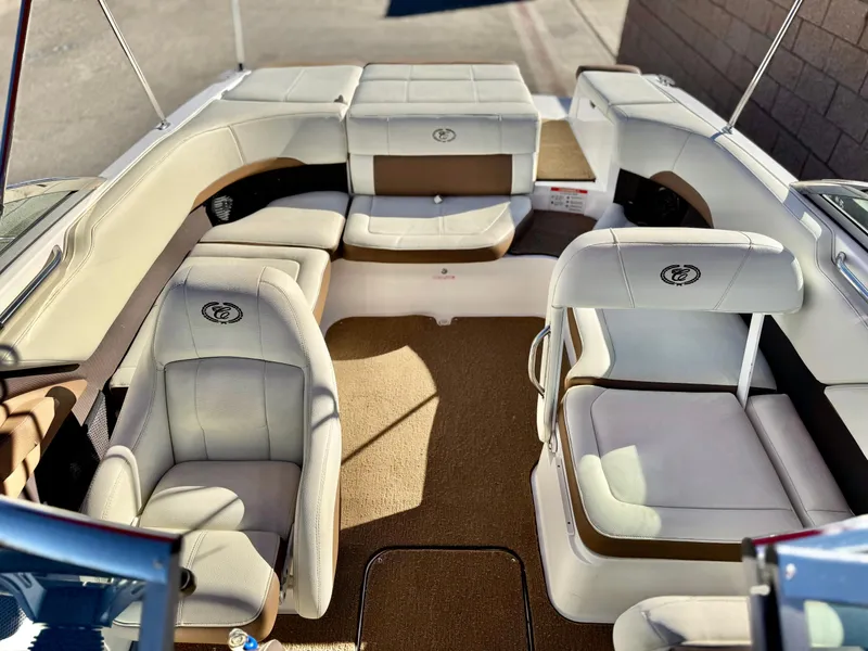 Slide: The Image of 2017 Cobalt 220S boat interior with beige and white seating. - 11