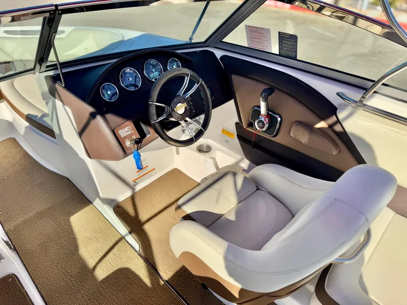 Slide: The Image of 2017 Cobalt 220S boat interior with steering wheel and dashboard controls. - 18