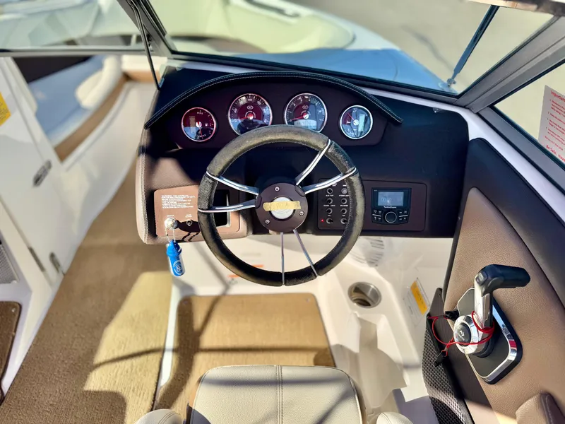 Slide: The Image of 2017 Cobalt 220S boat dashboard with steering wheel and control panel. - 19