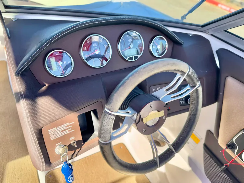 Slide: The Image of 2017 Cobalt 220S boat dashboard with steering wheel and gauges. - 20