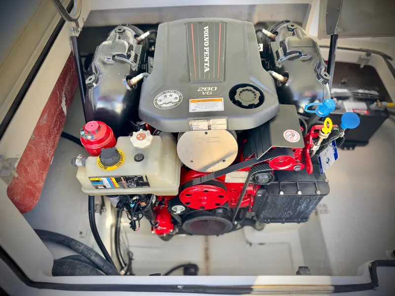 Slide: The Image of Engine compartment of a 2017 Cobalt 220S boat featuring a Volvo Penta engine. - 24