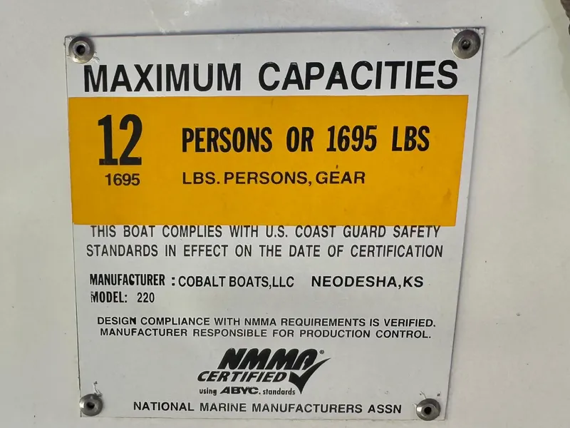 Slide: The Image of Cobalt 220S 2017 boat capacity label: 12 persons or 1695 lbs. - 29