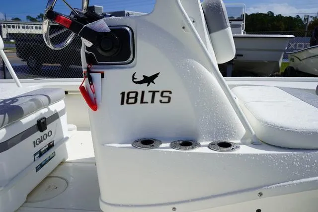 Slide: The Image of Mako 18 LTS 2025 boat interior with steering wheel and seating. - 10