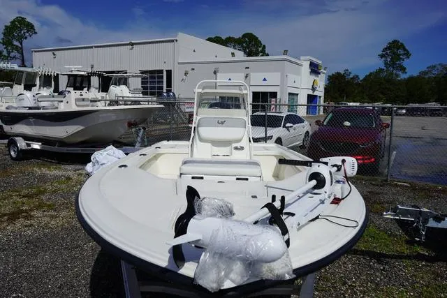Slide: The Image of 2025 Mako 18 LTS boat displayed outdoors at dealership. - 4