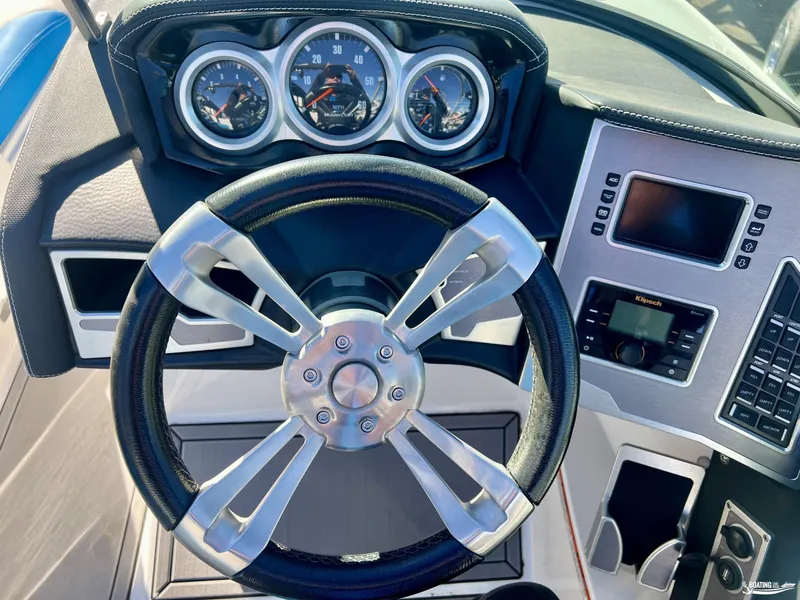 Slide: The Image of 2018 MasterCraft XT22 dashboard with steering wheel and control panel. - 9