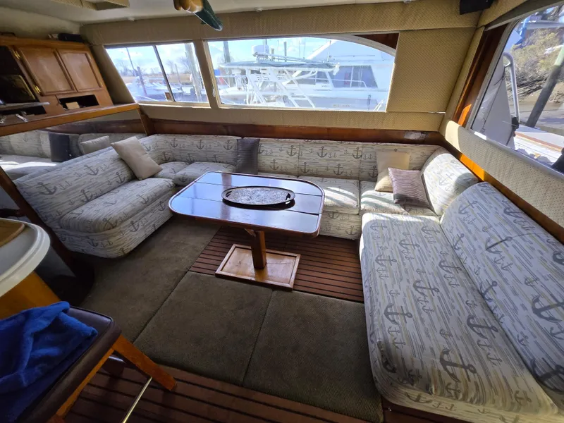 Slide: The Image of Interior of 1995 Egg Harbor 42 Convertible yacht with spacious seating and table. - 19