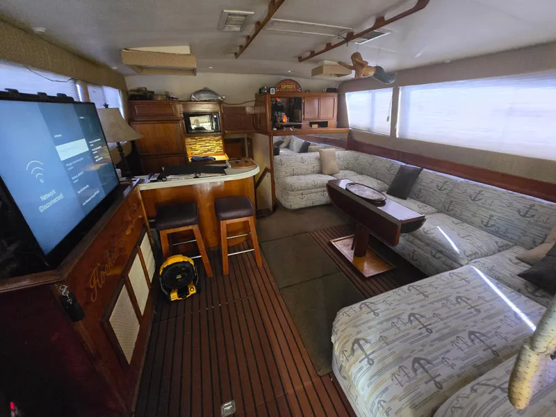 Slide: The Image of Luxurious interior of a 1995 Egg Harbor 42 Convertible yacht with cozy seating and modern amenities. - 2