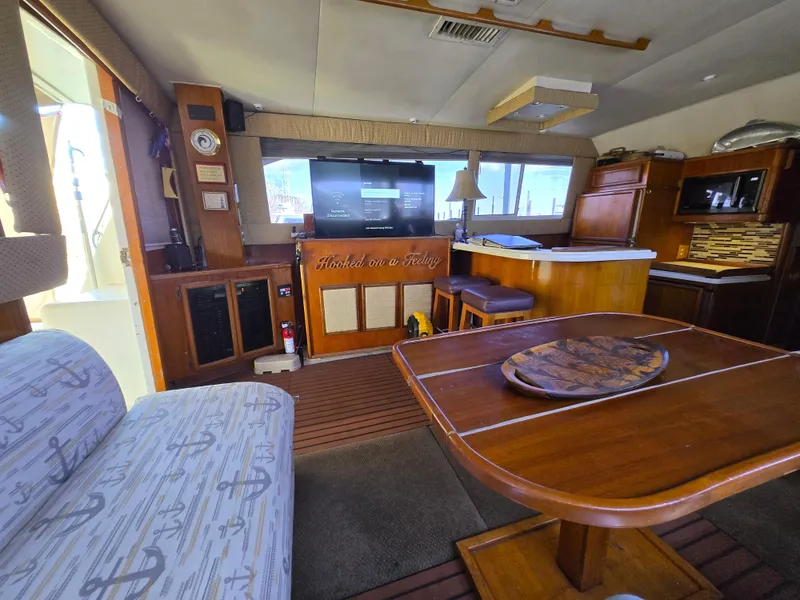 Slide: The Image of Interior of 1995 Egg Harbor 42 Convertible yacht with wooden furnishings and nautical decor. - 20