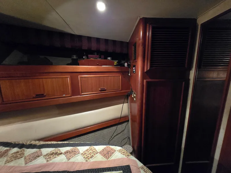Slide: The Image of Interior cabin of a 1995 Egg Harbor 42 Convertible yacht with wood cabinetry. - 29