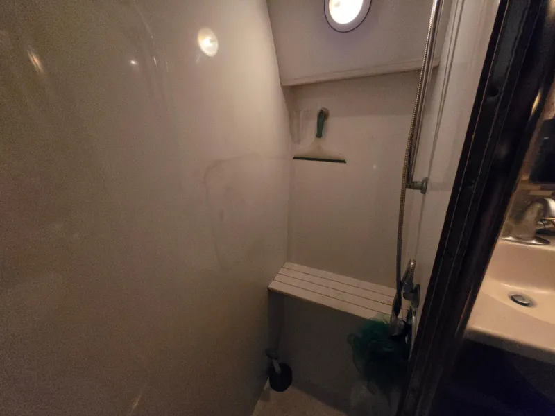 Slide: The Image of 1995 Egg Harbor 42 Convertible yacht bathroom with shower and sink. - 32