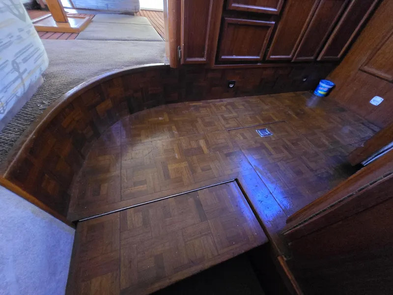 Slide: The Image of Interior of 1995 Egg Harbor 42 Convertible yacht with wooden flooring and steps. - 37