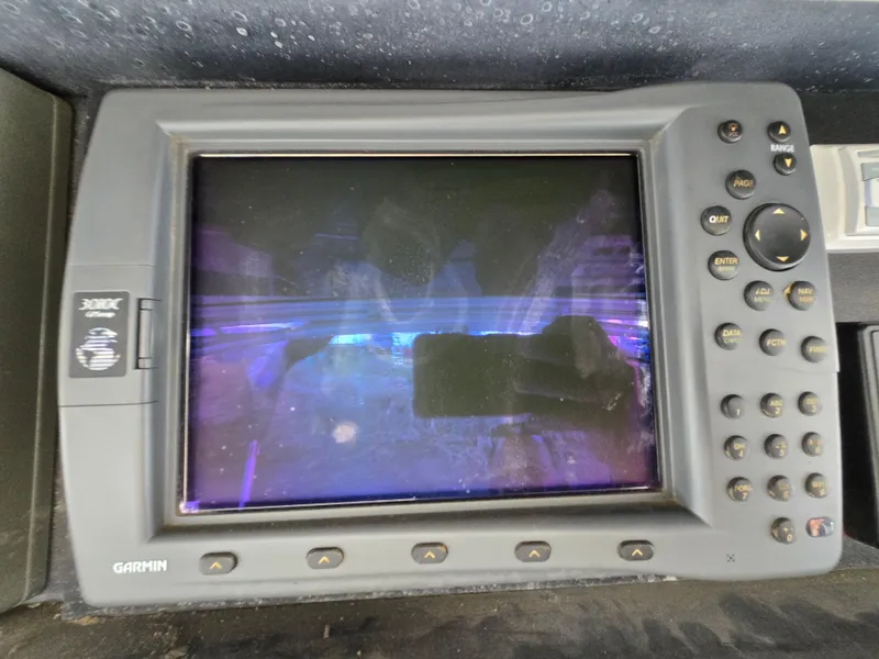 Slide: The Image of Garmin marine GPS device on 1995 Egg Harbor 42 Convertible boat dashboard. - 48