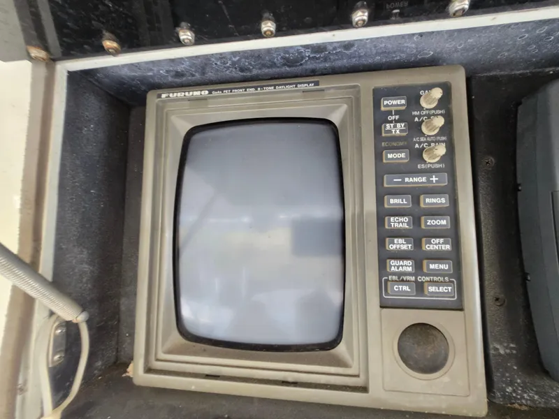Slide: The Image of Vintage Furuno radar display on a 1995 Egg Harbor 42 Convertible boat. - 49