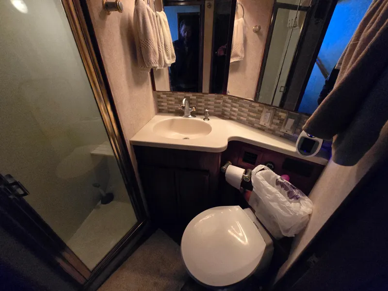 Slide: The Image of Bathroom interior of 1995 Egg Harbor 42 Convertible yacht with shower and sink. - 9