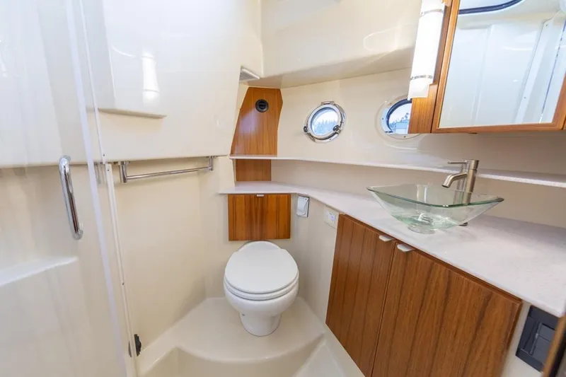 Slide: The Image of Luxurious bathroom in 2025 Ranger Tugs 43 Command Bridge yacht with modern fixtures. - 37