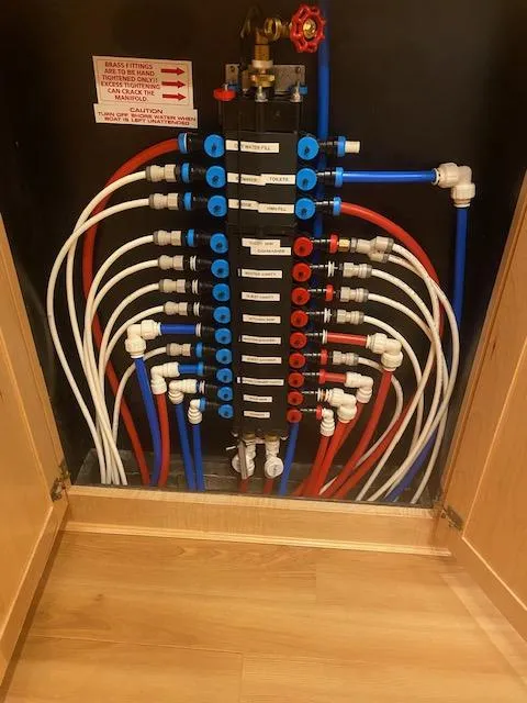 Slide: The Image of Plumbing system in a 2000 Sumerset 18x85 houseboat with labeled pipes and valves. - 11