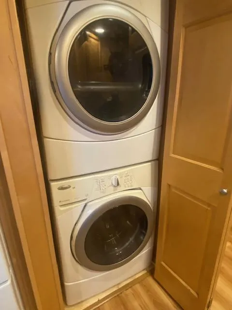 Slide: The Image of Stacked washer and dryer in 2000 Sumerset 18x85 houseboat laundry area. - 19