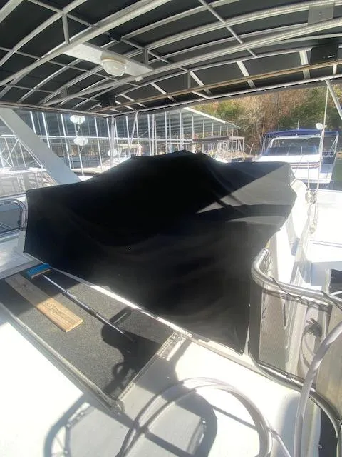 Slide: The Image of 2000 Sumerset 18x85 houseboat docked under covered marina. - 31