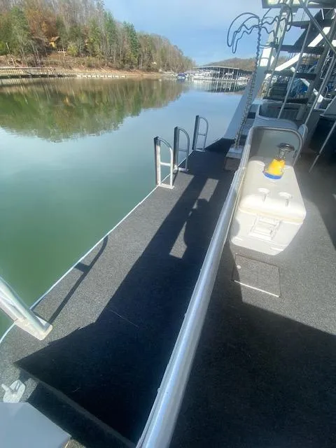 Slide: The Image of 2000 Sumerset 18x85 houseboat deck with lake view and cooler. - 33