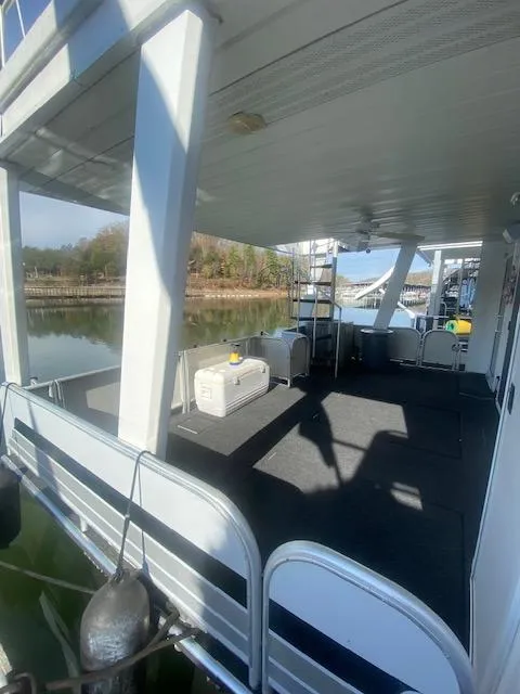 Slide: The Image of 2000 Sumerset 18x85 Houseboat with spacious deck and scenic lake view. - 34