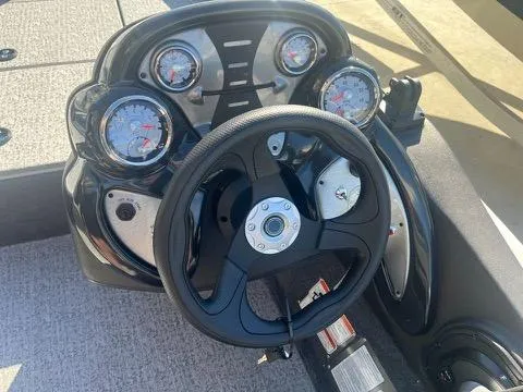 Slide: The Image of 2024 Tracker Pro Team 175 TXW boat dashboard with steering wheel and gauges. - 14