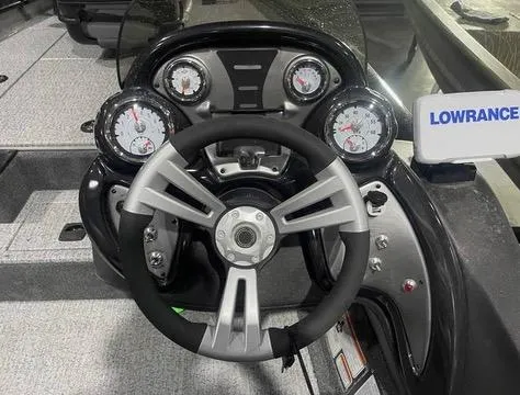 Slide: The Image of 2024 Tracker Pro Team 175 TXW dashboard with steering wheel and gauges. - 16